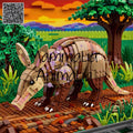 A brick-built aardvark model standing in a colorful toy savanna scene with grass, trees, mountains, and a sunset sky. A QR code appears in the top-left corner, and a large semi-transparent watermark reading 'Mammalia Animal' overlays the center.